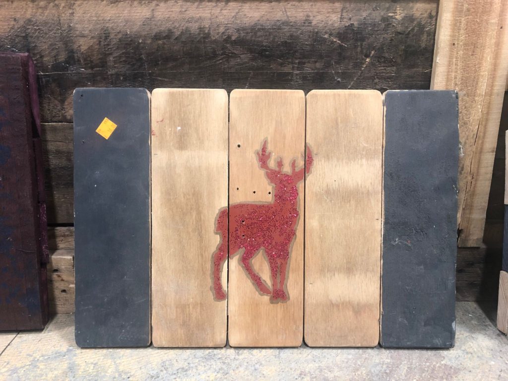 Wooden decor featuring a reindeer.