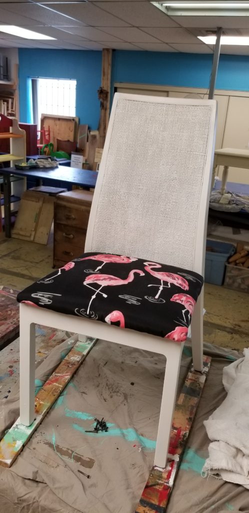 A bold flamingo-patterned chair from the ReStore