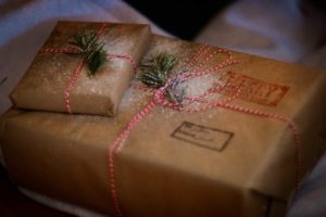 Using brown paper shopping wrapping paper or recycling newspapers or comics are good ways of reducing gift wrapper waste.